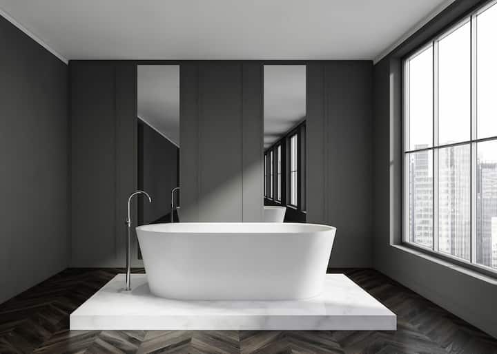 A stand alone bathtub installation adds aesthetic value to a Long Beach, CA bathroom.